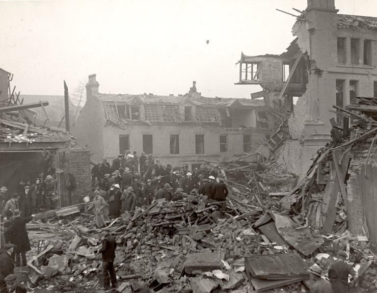 Black and white photo workers attempt to recover bodies from collapsed building. Merseyside Police/ National Museums Liverpool.