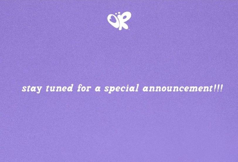 Olivia’s website “stay tuned for a special announcement.” With a purple background. 