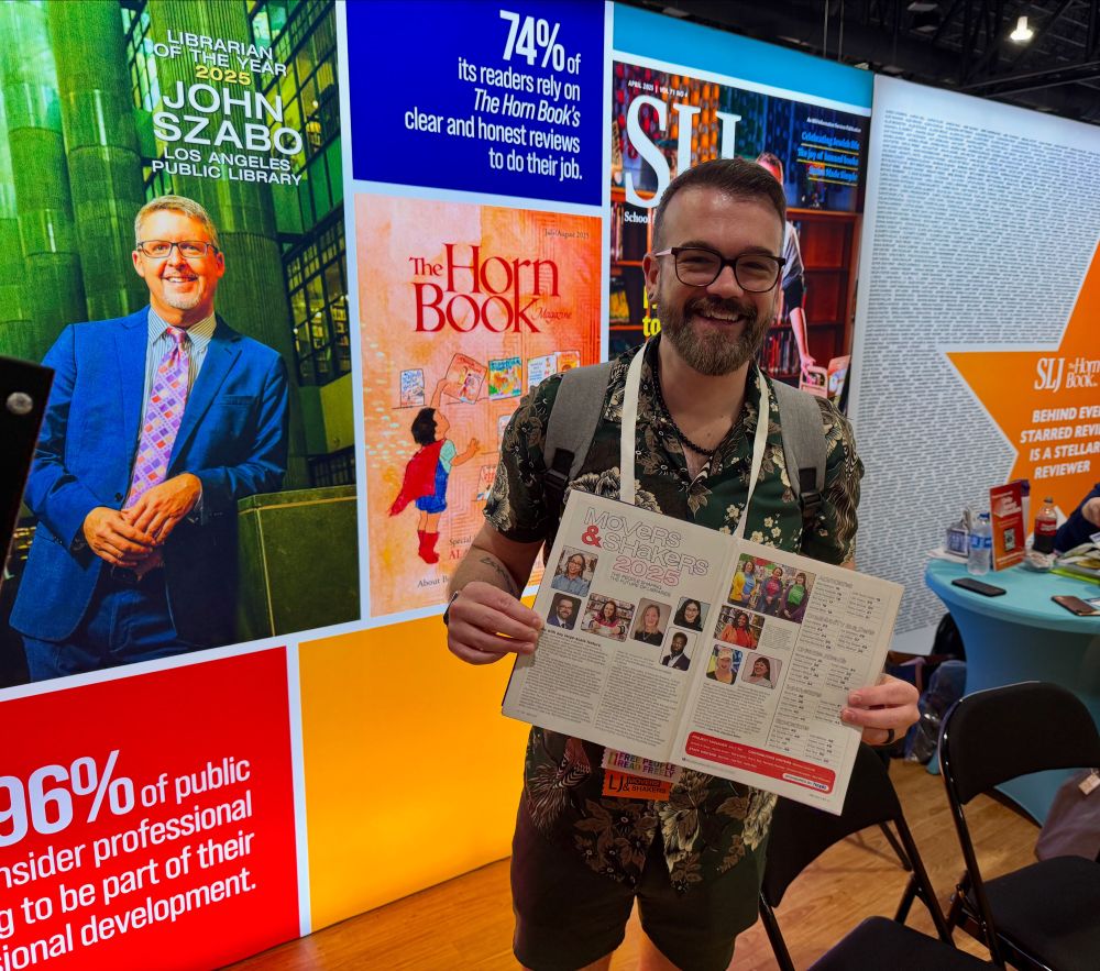 Jason Homer highlighting his Library Journal Mover & Shaker article by holding a copy of the magazine 