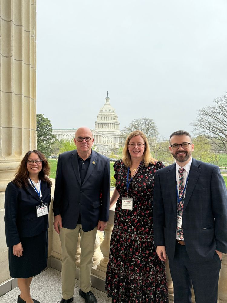 Congressman Jim McGovern with librarians Jason Homer, Melissa Harter, and Maria McCauley