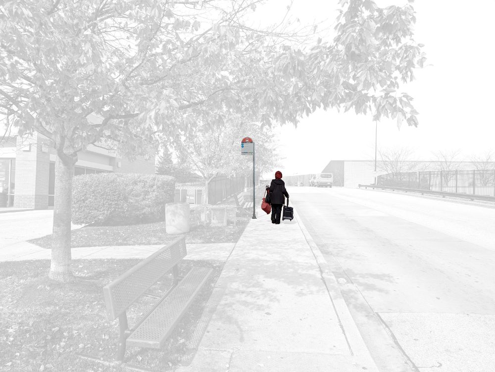 Person walking to a bus stop