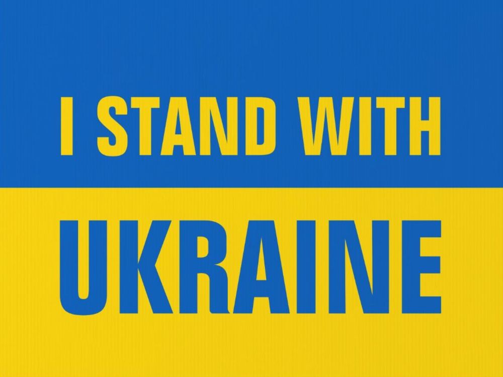 Blue and yellow Ukranian flag with the words I stand with Ukraine