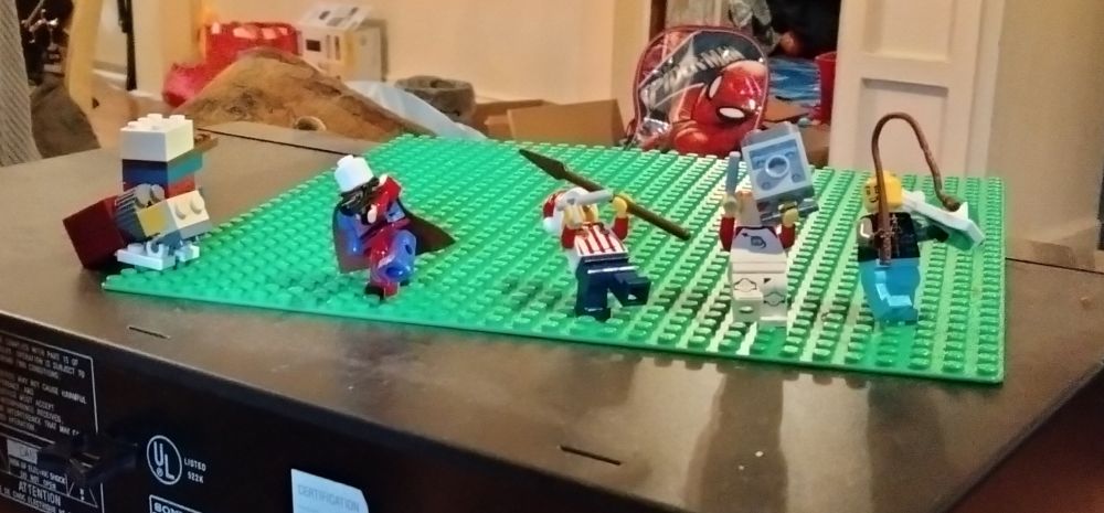 My son is showing his Lego player versus player set. 