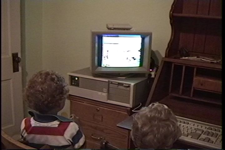 Two children sitting in front of an 
AST Premium/286