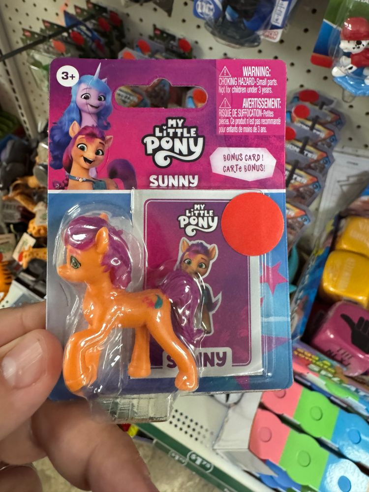 A My Little Pony “Sunny” toy with a red sticker on it.