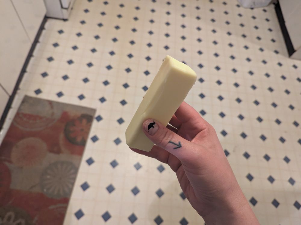 holding a stick of butter like a candy bar