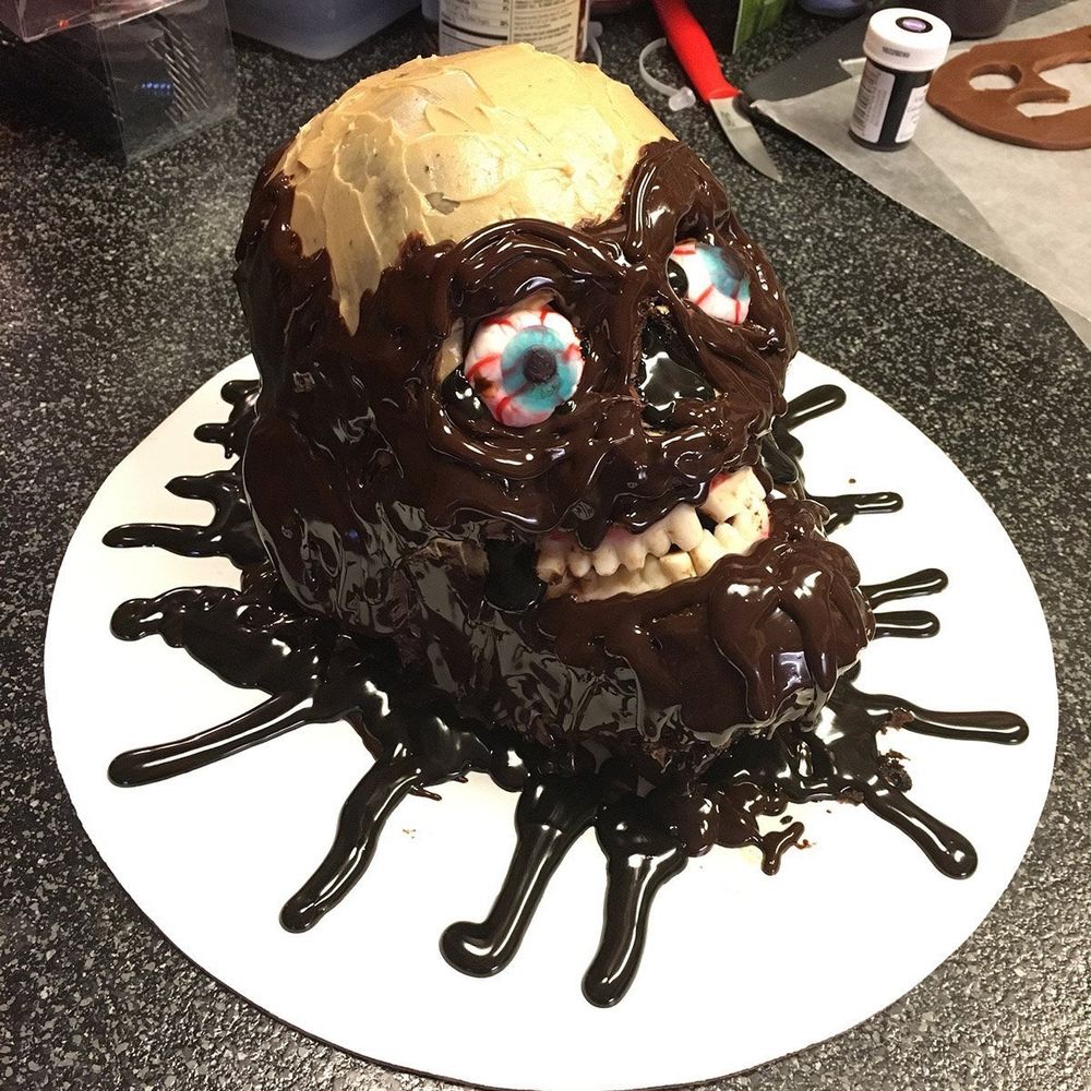 return of the living dead tarmam cake profile skull splattered in chocolate syrup by greg rozeboom 