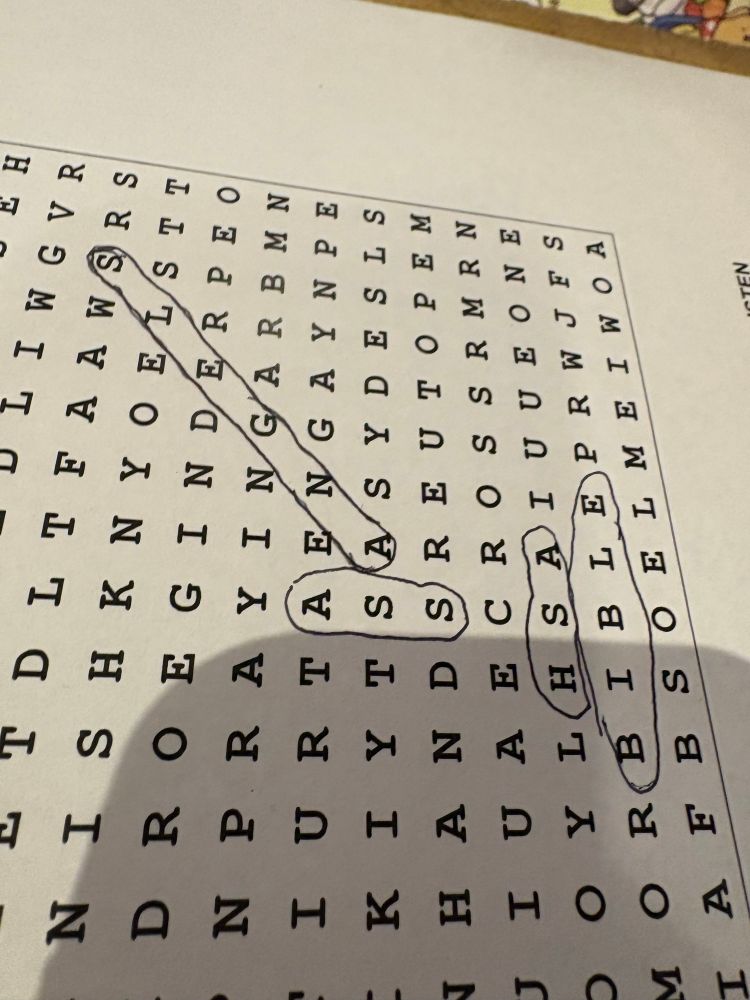 A word search where a child circled ass