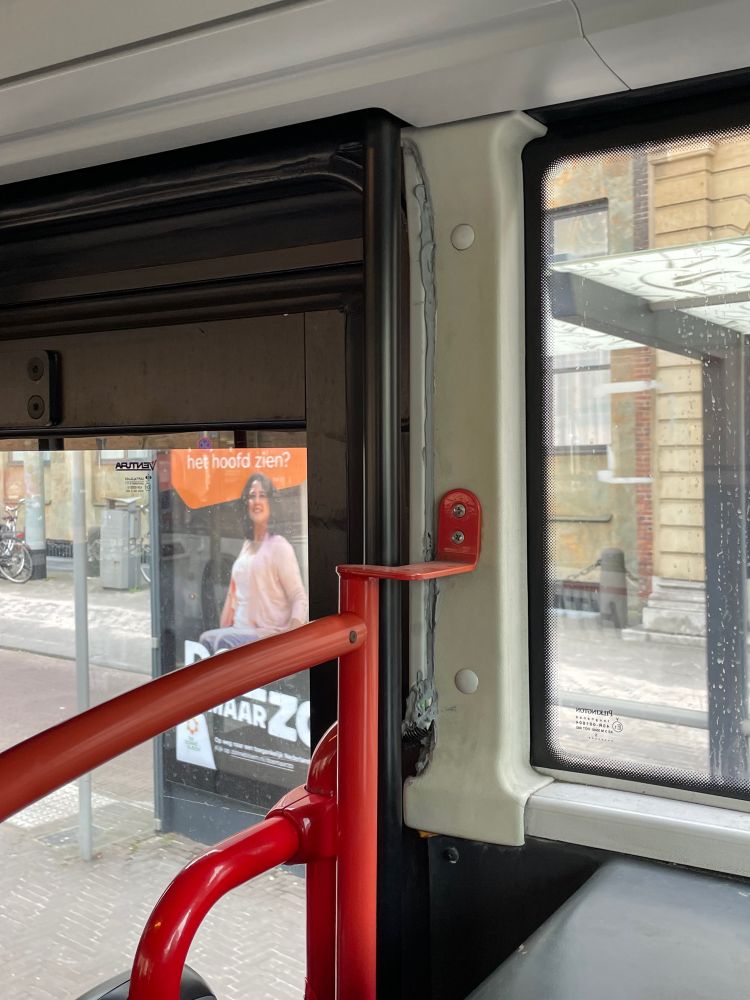 Bus door with putty around the edges.