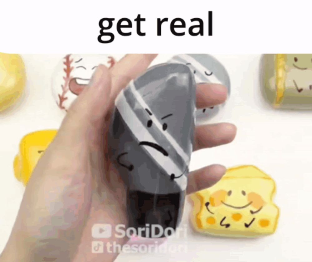 a person is holding a squishy toy that says get real on the bottom