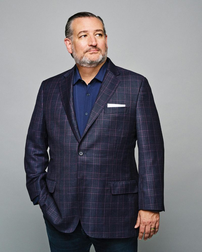 A man in a purple checked jacket. 