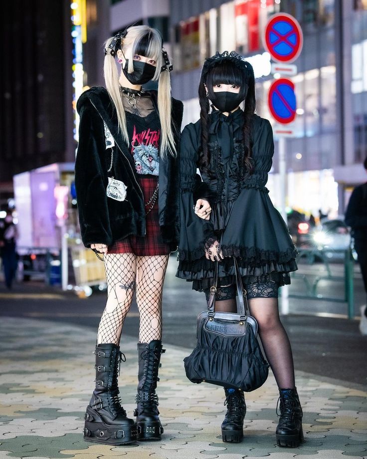 Two young women in Harajuku wearing goth/ punk clothing