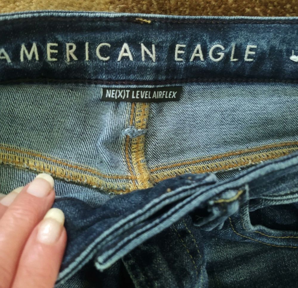 The inside of AE jeans shows serged seams. 