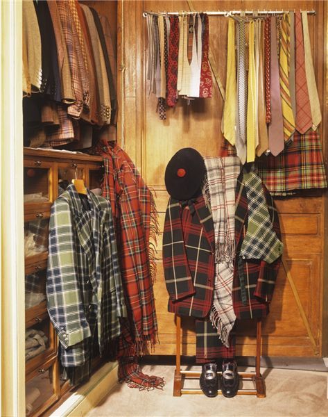 Racks of colorful tailored jackets and neckties. 