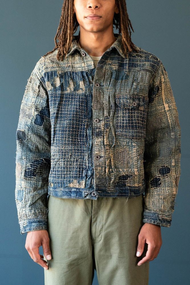 Kapital's patchwork boro jacket. The fabric is made from multiple layers of hand-distressed fabric, so it imitates the look of Japanese boro (repaired fabric)