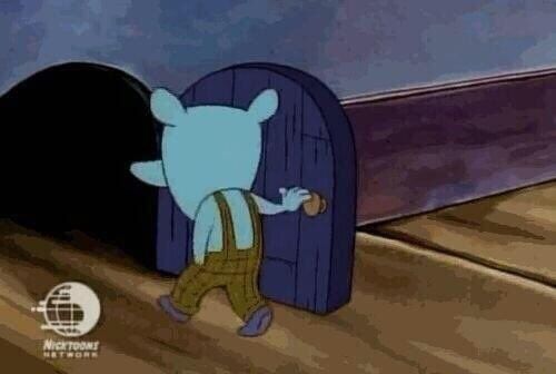 A blue cartoon mouse walks through a tiny door in the wall