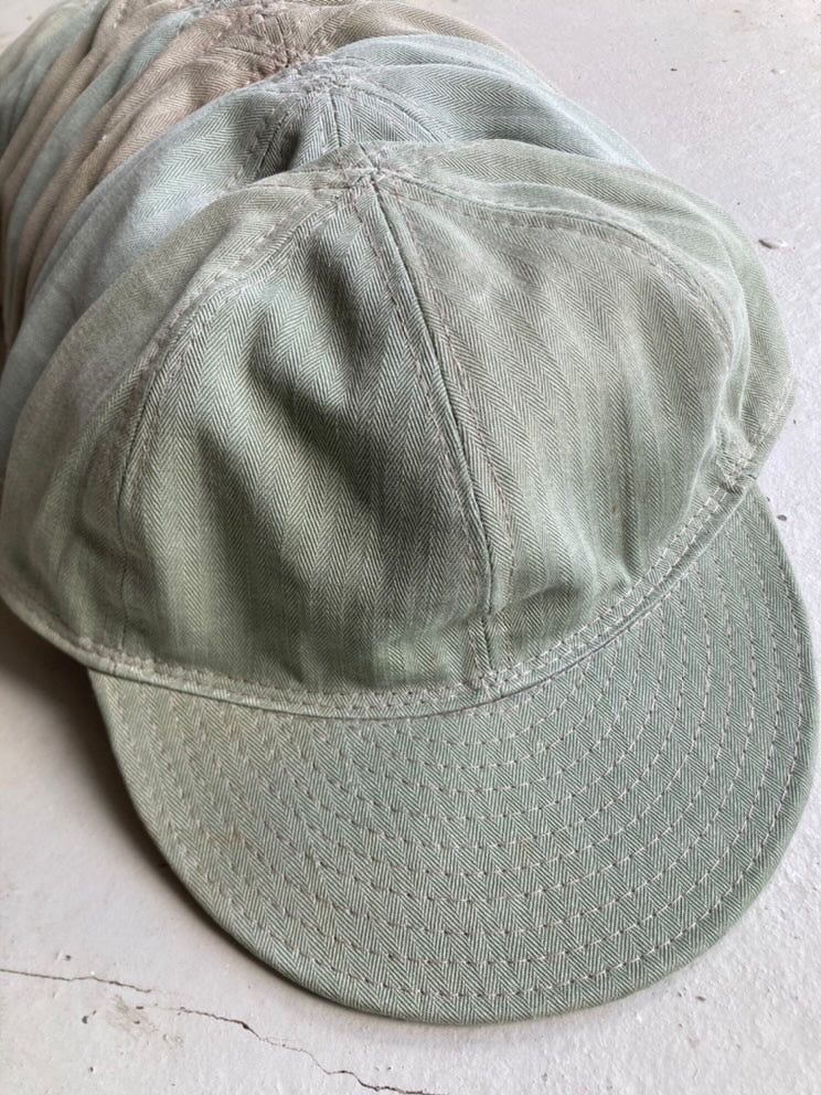 Green Papa Nui cap modeled after a vintage workwear design.