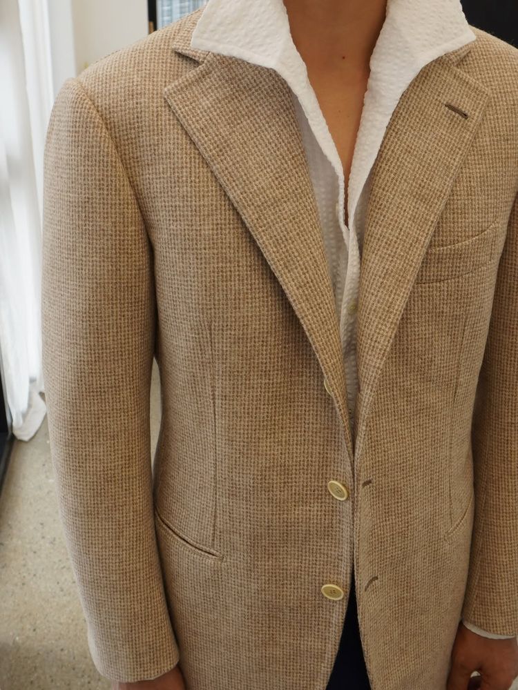The front of the tweed. It has a lot of shape through the chest and lapels. 