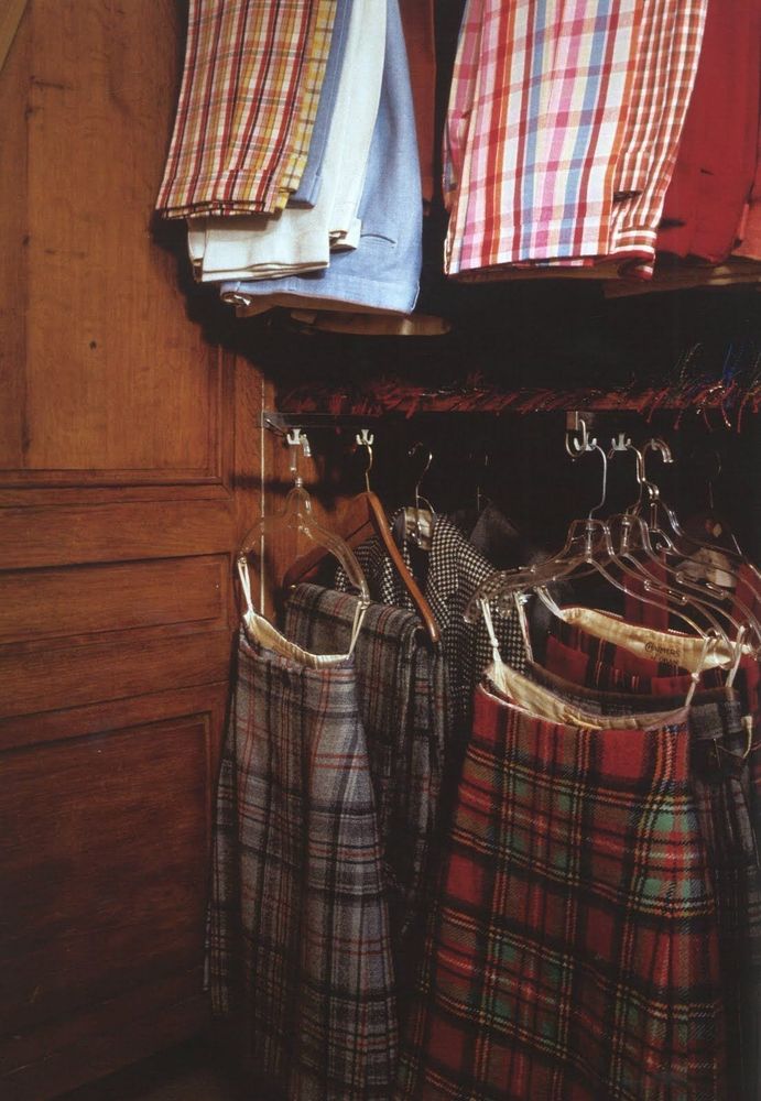 Racks of colorful tartan kilts and trousers. 