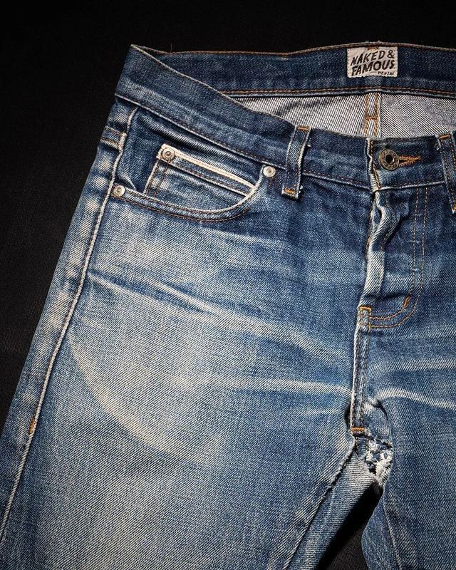 Naked & Famous jeans that have been naturally faded through wear. 