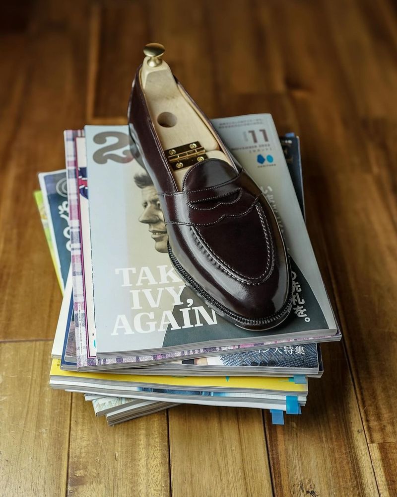 A brown leather loafer