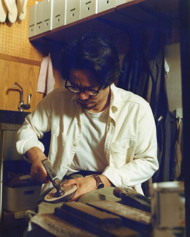 A man making a pair of shoes