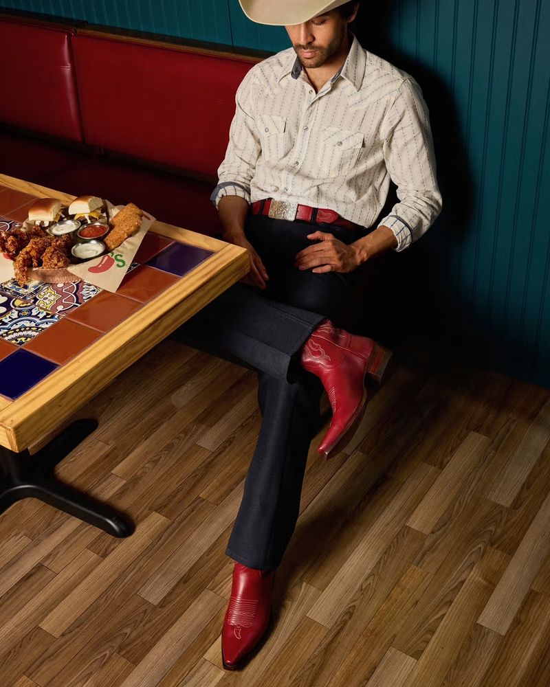 Man wearing red cowboy boots