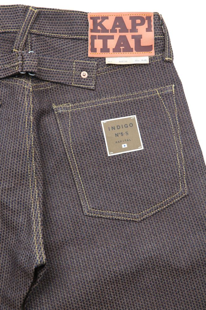 Kapital's uniquely textured "century denim." The denim has small dots all over it. 