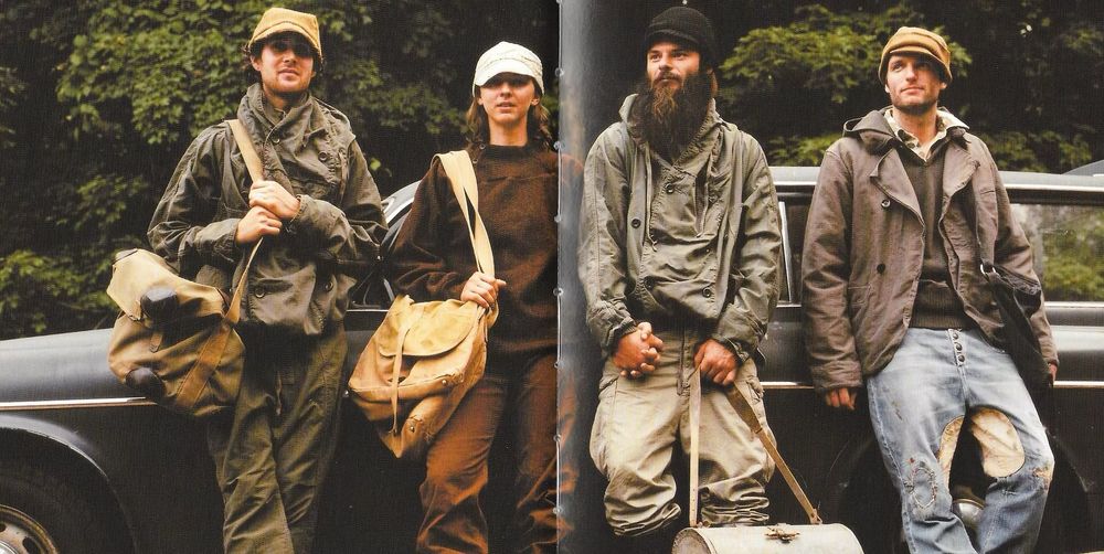 A page from a Kapital lookbook. They are wearing strangely shaped coats with patchwork jeans and shoulder bags.