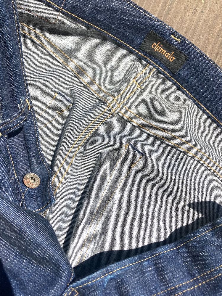 The inside of Chimala jeans shows flat-felled seams. 