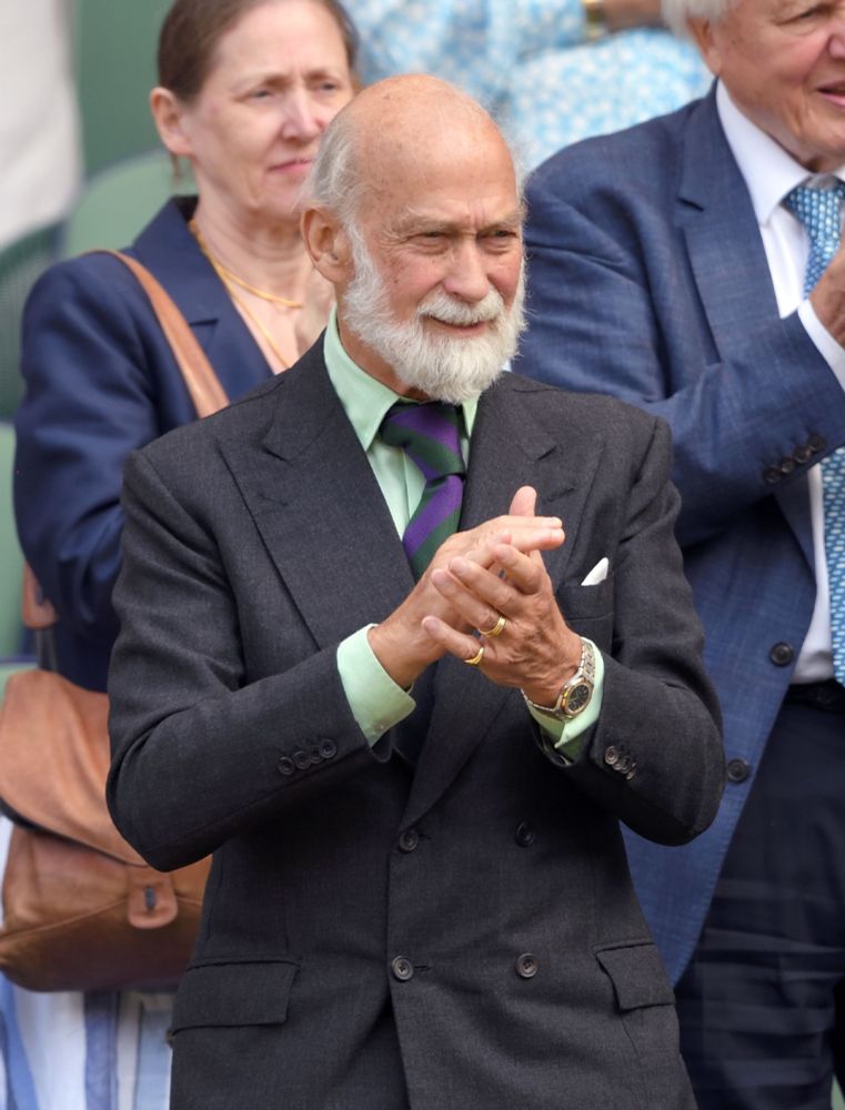 Prince Michael of Kent wearing a double-breasted suit with a tie knot that's perhaps a third of the size of his head. 