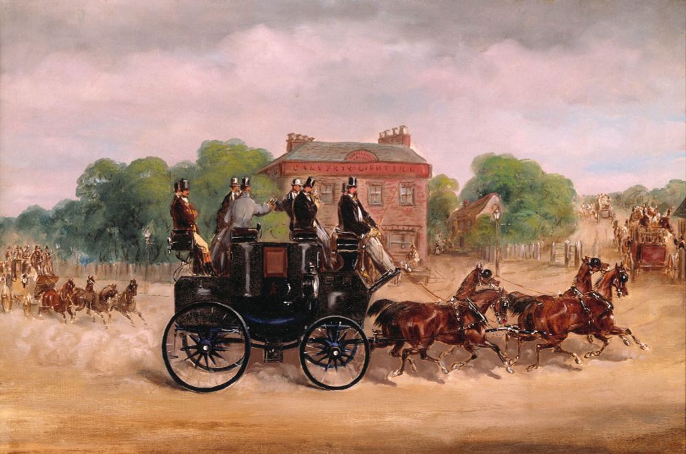 A photo of a 19th century drag race. People are sitting on top of a drag (a lightweight carriage) that is being drawn by four racing horses. Dust is flying up everywhere, showing that the horses are moving quickly. 
