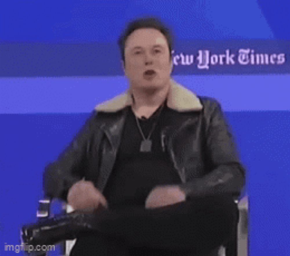 elon musk is sitting in front of a blue wall with the words enjoy on it