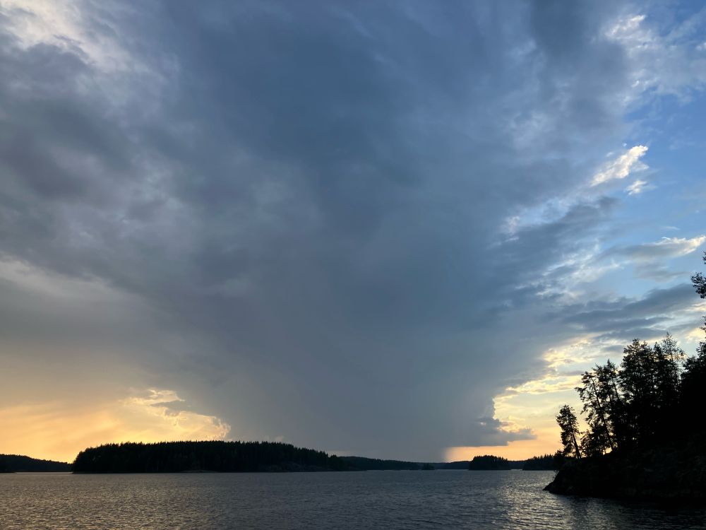 Thunder storm passing from Rantasalmi and Linnansaari National Park towards Kangaslampi and Varkaus. The sun is behind the storm cloud and yellow is spilling out the sides. 

This is a classic route for storms in the summer - but not had any storms for 10 days.

Still hot and still no rain.