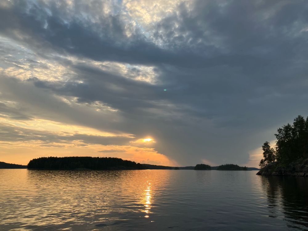 Thunder storm passing from Rantasalmi and Linnansaari National Park towards Kangaslampi and Varkaus. 

The sun is emerging from behind the storm and is a deep golden yellow reflected in the water below. 

This is a classic route for storms in the summer - but not had any storms for 10 days.

Still hot and still no rain.