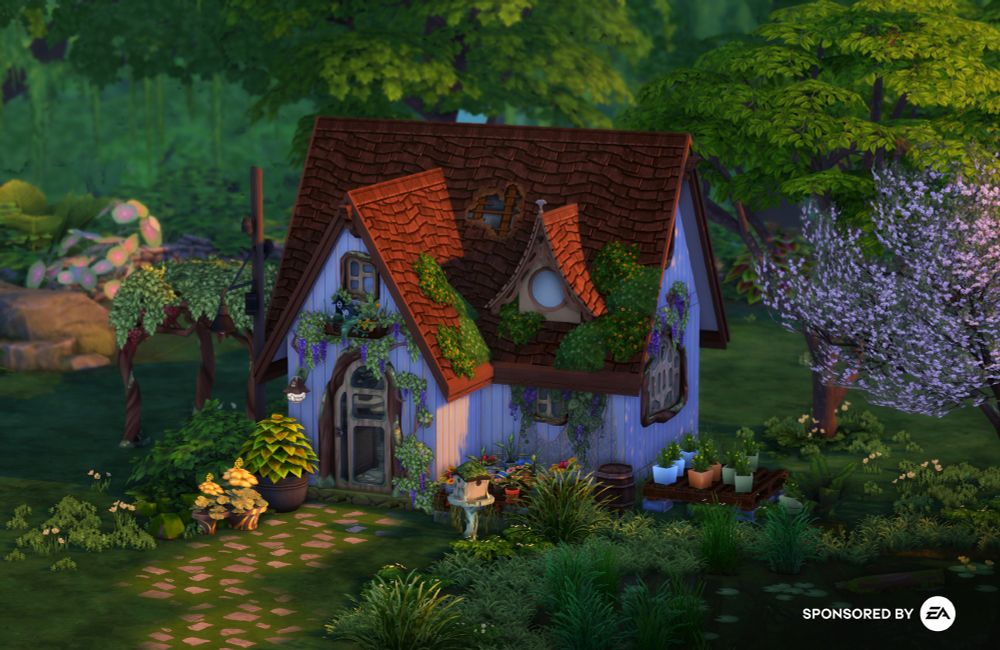 Fairytale cottage surrounded by tall trees.