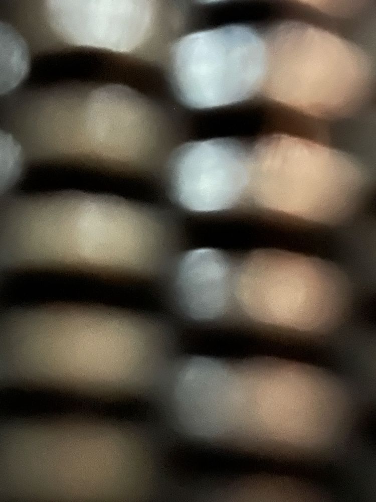 Abstract picture of brown and white stripes out of focus.