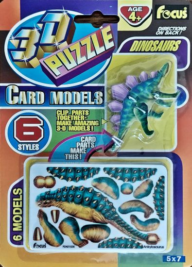 Packaging for “3D Puzzle Card Models - Dinosaurs” showing a completed cardstock Stegosaurus and numerous incomplete cards i side the package.