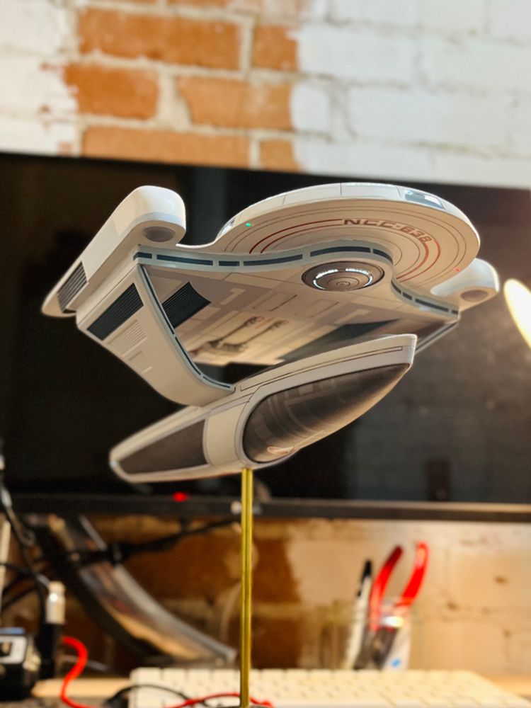 Underside view of a fully assembled model kit of the USS Grissom from Star Trek. 
