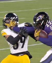 Ravens’ Derrick Henry stiff-arms a Steelers tackler 