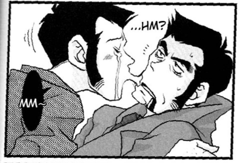 Lupin dramatically kissing the corner of Zenigata’s mouth. Zenigata seems disheveled, disoriented, and a little annoyed. Blood is dripping from the other side of his mouth. Lupins text bubble reads as a little hum, Zenigata groans slightly, apparently waking up. 