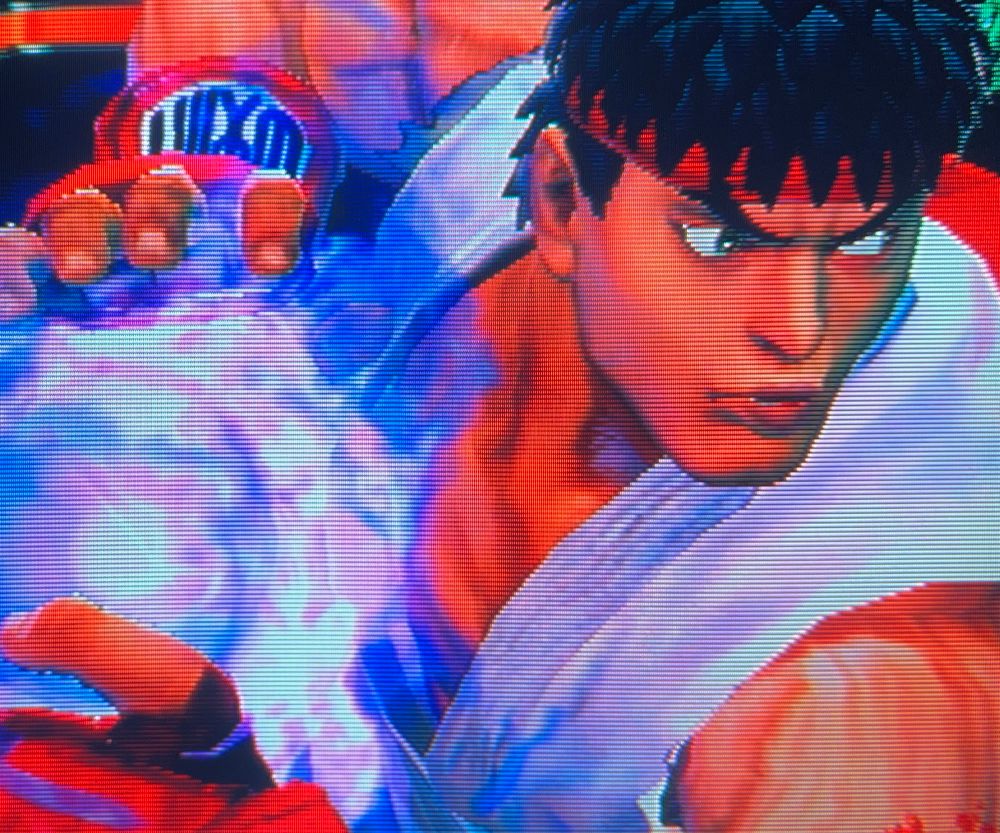 Ryu charges his Ultra Combo, Metsu Hadouken, in an animation that always reminded me of the intro to Super Street Fighter 2 