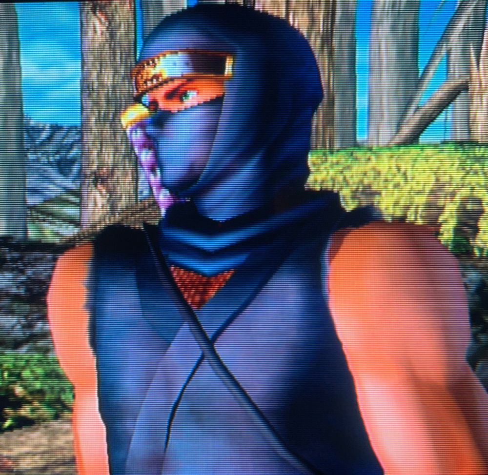 Ryu Hayabusa in his OG blue, putting the FIT in outfit as he looks out toward the sky with soothing emerald eyes // Dead or Alive 2 Hardcore for Playstation 2, photography on CRT TV 