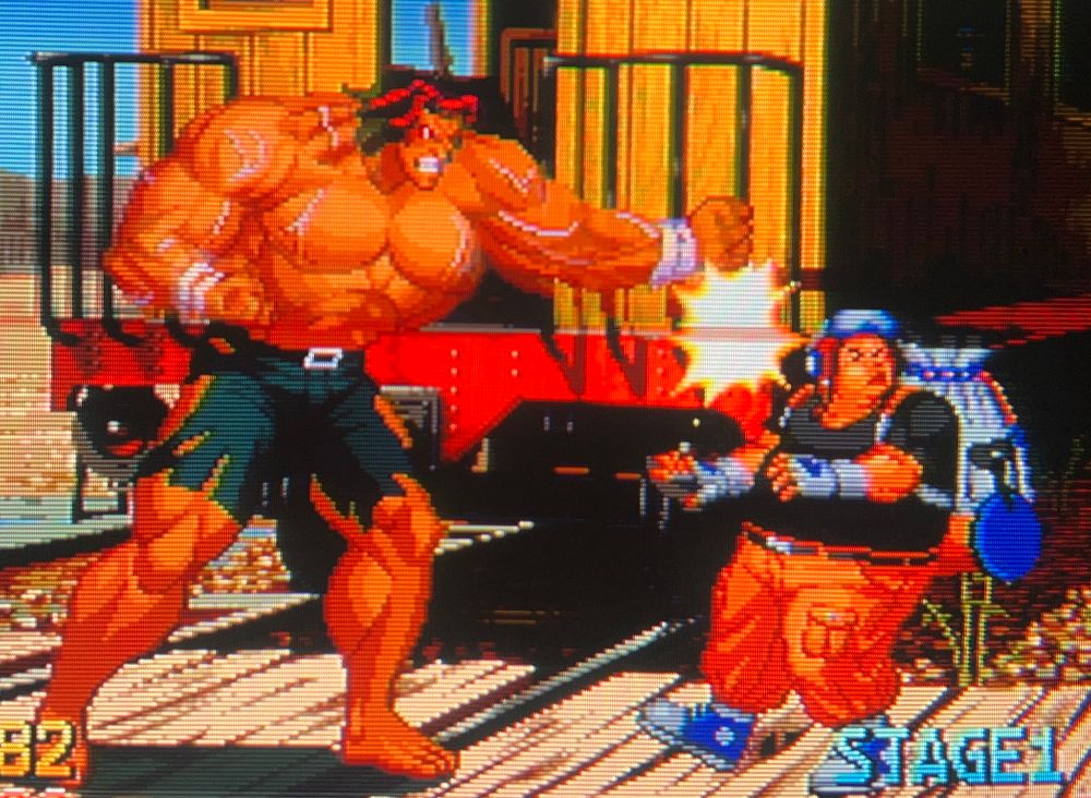 The final boss Wyler delivers his iconic back punch that loops into itself, over and over on Wang Koh-San 