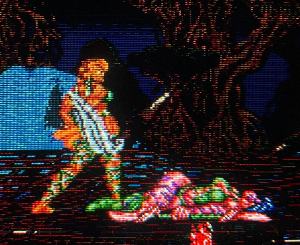 Talazia stands victorious over Divada, whose guts have been spilled across the floor of the arena // Weaponlord for Sega Genesis, photography on CRT TV 