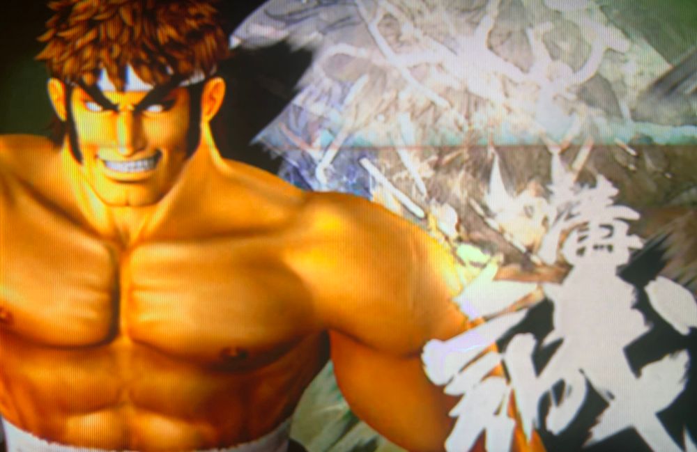 Mizoguchi splash screen in the wild and raucous intro animation // The King of Fighters: Maximum Impact Regulation A for PlayStation 2, photography on CRT TV 