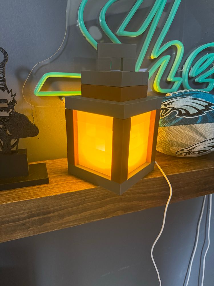 A 3d printed Minecraft lantern with LED lights.