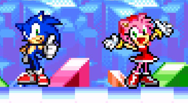 sonic and amy posing at the end of a stage. sonic is giving a thumbs up while amy has her arms out and hands in the air