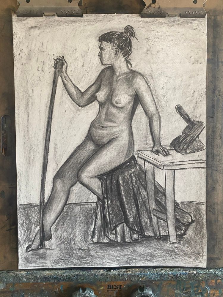 a charcoal drawing of a feminine person sitting on a stool holding a staff 