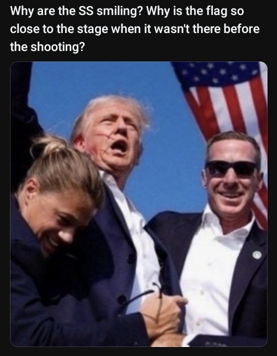 Screencap of social media from July 14, 2024, showing the image of Donald Trump pumping his fist with red liquid on his right ear under a US flag. He is flanked by 2 people, both of whom are smiling. This image is now seen online with their smiles changed to grim expressions.
The caption reads "Why are the SS smiling? Why is the flag so close to the stage when it wasn't there before the shooting?"